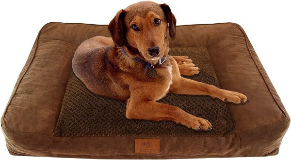 A round-shaped dog bed resembling a couch.