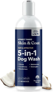 Bottle of Honest Paws Skin and Coat 5-in-1 Dog Wash against a clean backdrop