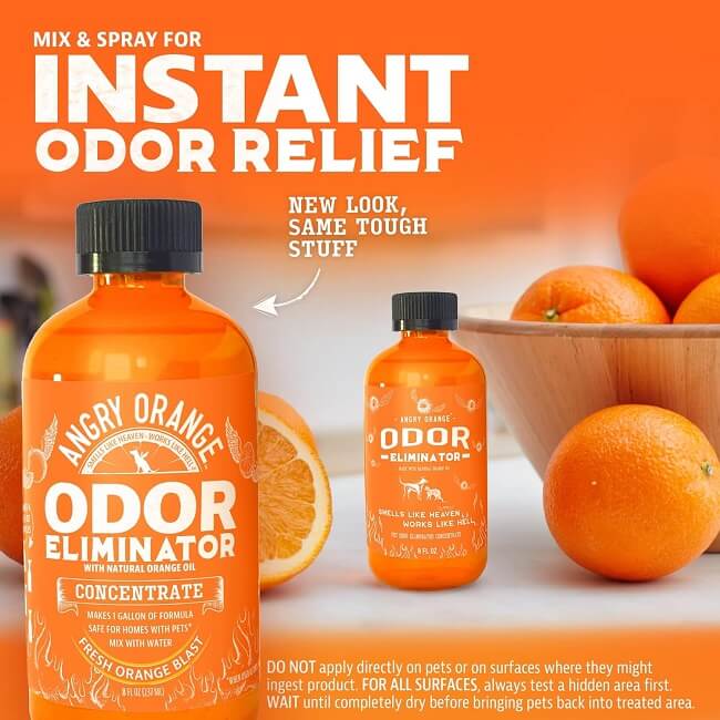 Bottle of Angry Orange Pet Odor Eliminator surrounded by fresh oranges and a cat and dog silhouette