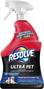 Bottle of Resolve Ultra Pet Odor and Stain Remover Spray surrounded by a clean carpet, upholstery, and area rug