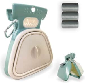 A handheld Jondarla Pooper Scooper with attached waste bag container, ideal for traveling with large and small dogs outdoors.