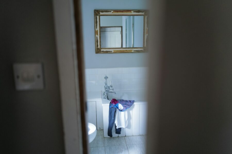 Owner bathing dog home bathroom