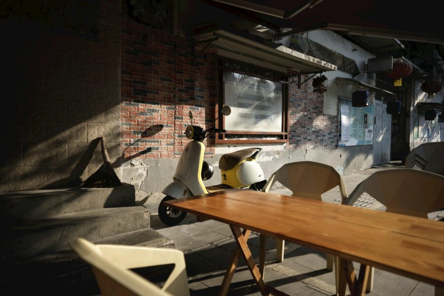 Dog lying under table cafe